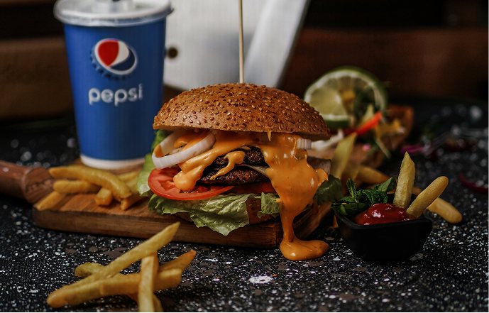 A burger and fries plated for service
