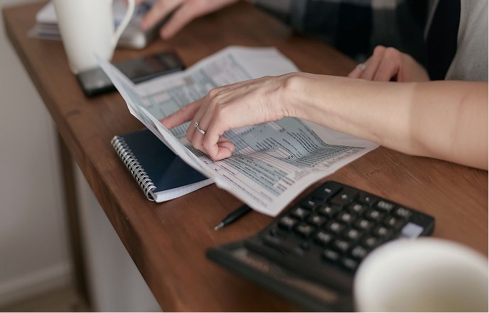 Statements and a calculator on the desk