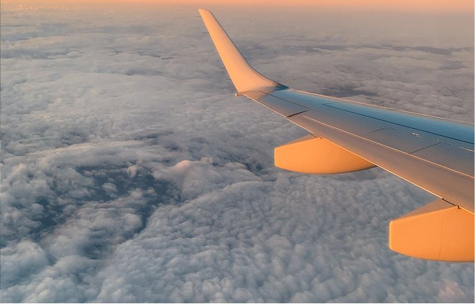 A wing above the clouds